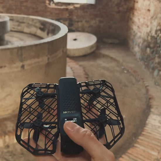 HOVERAir X1 ProMAX 8K Action Flying Camera Drone shown folded and ready for adventure filming. The compact flying action camera features 8K video recording, SmoothCapture 2.0 stabilization, and hands-free automatic flight modes. Ideal for travel, sports, and outdoor activities, this lightweight foldable drone delivers cinematic footage from unique perspectives. It follows movement up to 42 KM/H and handles various terrains with OmniTerrain flight capability, including snow and coastal environments. Designed